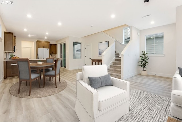 living room with light hardwood / wood-style floors