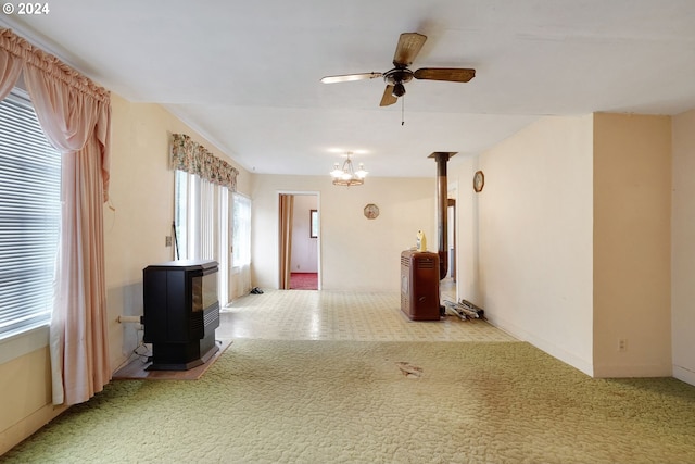 hall featuring an inviting chandelier and light colored carpet