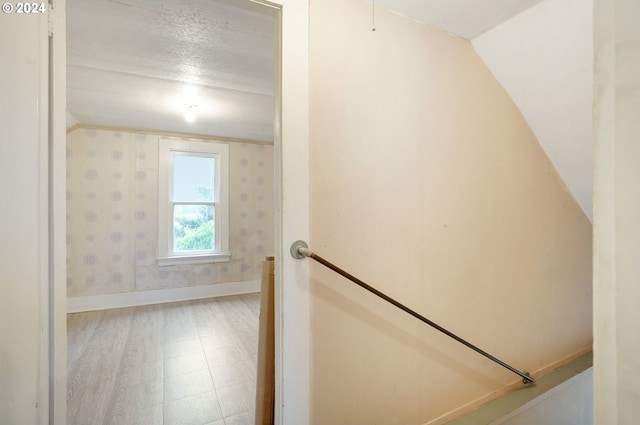 stairs with vaulted ceiling