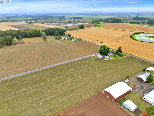 birds eye view of property with a rural view