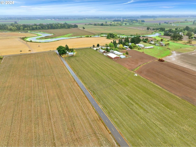 birds eye view of property with a rural view