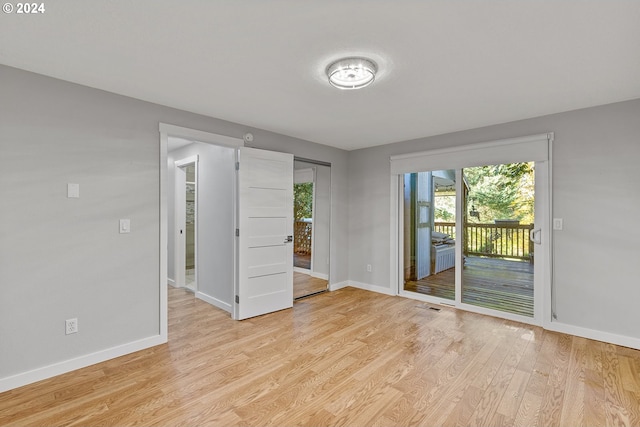 spare room featuring light wood-type flooring