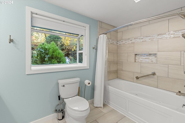 bathroom featuring toilet and shower / tub combo with curtain