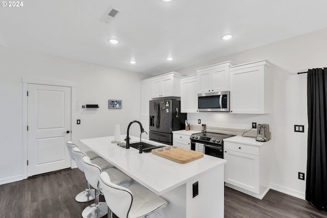 kitchen featuring electric range, sink, white cabinets, a center island with sink, and black refrigerator with ice dispenser