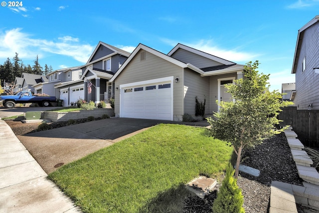 view of front of property with a garage and a front lawn