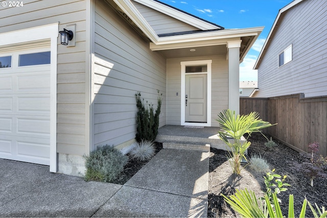 entrance to property featuring a garage