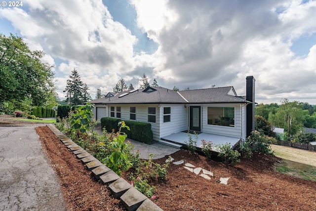 rear view of property with a patio