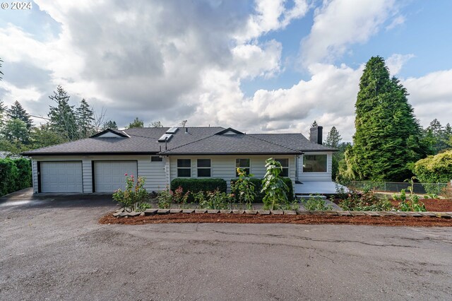 ranch-style house featuring a garage