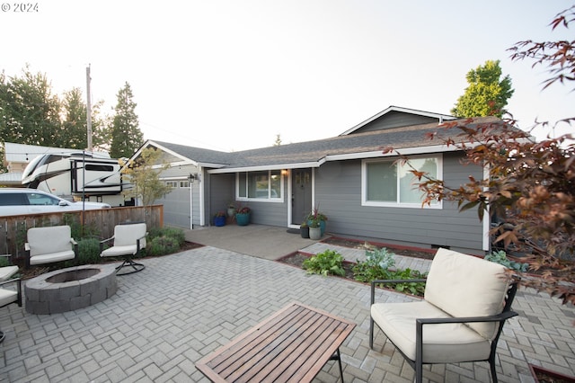 view of patio / terrace featuring an outdoor fire pit