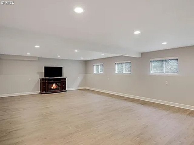 basement featuring light hardwood / wood-style flooring