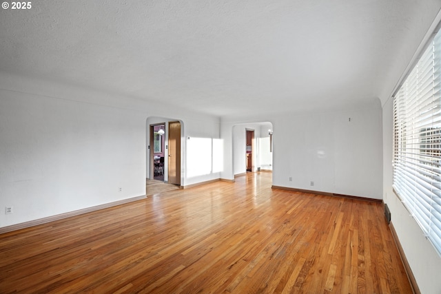 interior space with light hardwood / wood-style flooring and a textured ceiling