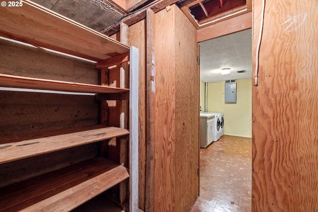 interior space featuring separate washer and dryer and electric panel