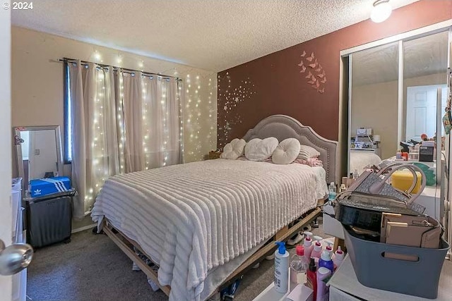 carpeted bedroom featuring a textured ceiling