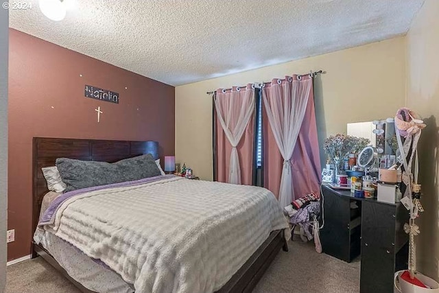 carpeted bedroom featuring a textured ceiling