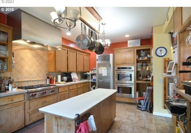 kitchen featuring backsplash, custom range hood, stainless steel appliances, pendant lighting, and a notable chandelier