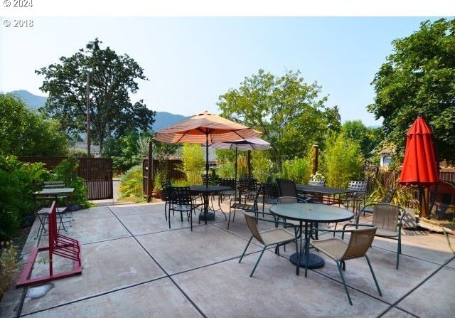 view of patio / terrace featuring a mountain view