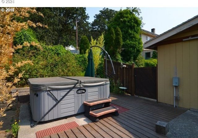 deck with a hot tub