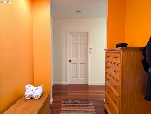 corridor with dark wood-type flooring