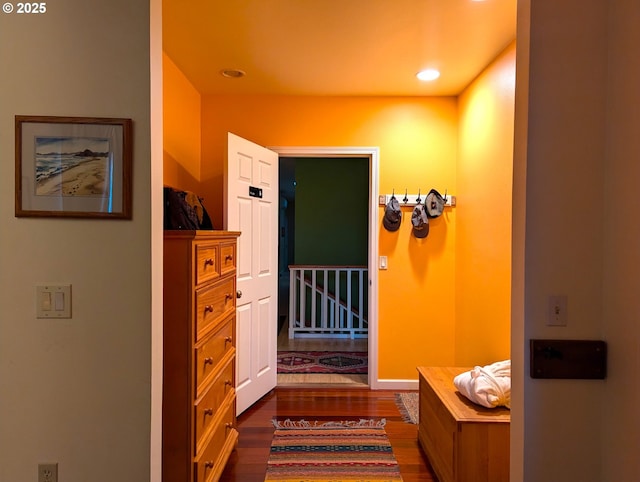 hallway featuring dark hardwood / wood-style flooring