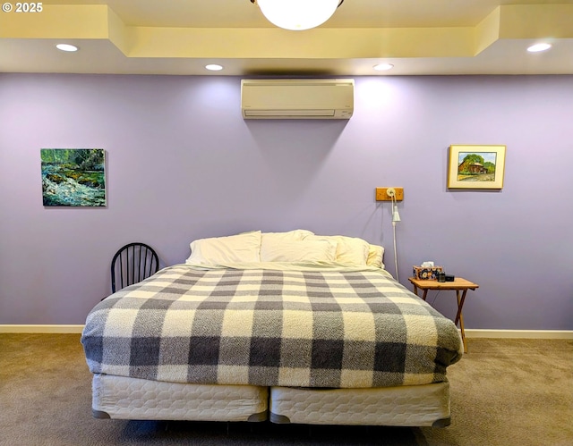 bedroom featuring an AC wall unit and carpet floors