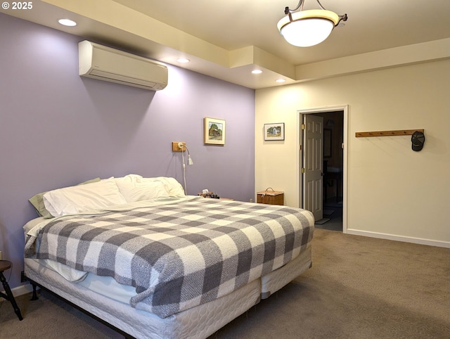 bedroom with an AC wall unit and carpet flooring