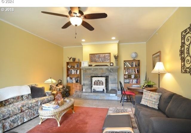 living room with ceiling fan and crown molding