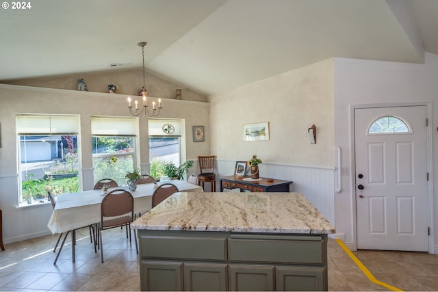 455 Chandler Dr, Roseburg, OR 97471 - kitchen with a chandelier, light tile patterned flooring, vaulted ceiling, gray cabinetry, and wainscoting