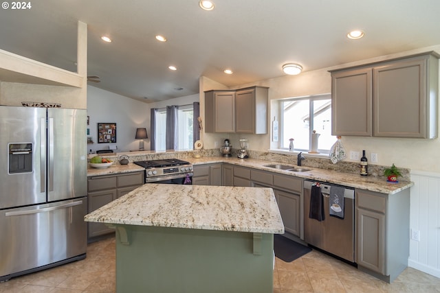 455 Chandler Dr, Roseburg, OR 97471 - kitchen with appliances with stainless steel finishes, gray cabinetry, a sink, a kitchen island, and vaulted ceiling