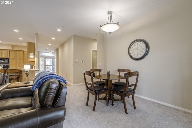 view of carpeted dining space