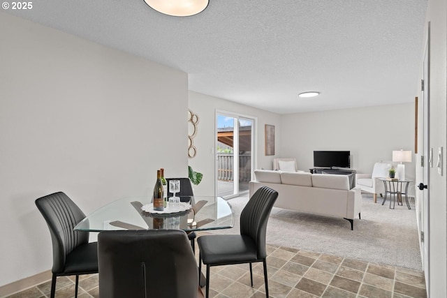 342 NW Denton Ave, Dallas, OR 97338 - dining space with carpet floors and a textured ceiling