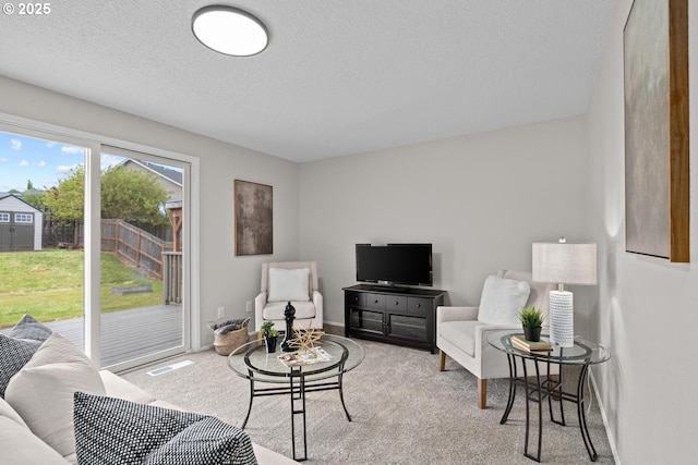 342 NW Denton Ave, Dallas, OR 97338 - carpeted living room with a textured ceiling and baseboards