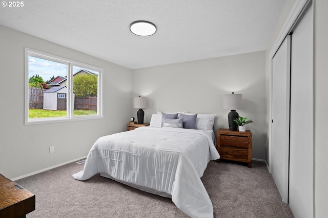 342 NW Denton Ave, Dallas, OR 97338 - bedroom featuring carpet floors, baseboards, and a closet