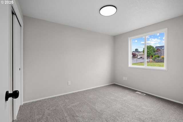 342 NW Denton Ave, Dallas, OR 97338 - unfurnished bedroom with carpet flooring, a closet, and baseboards