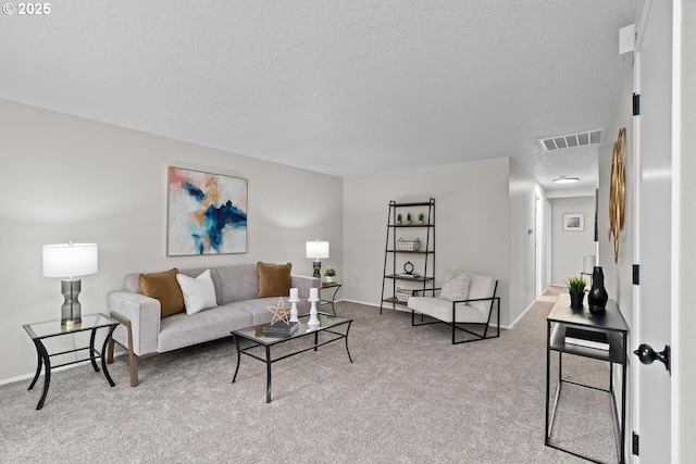 342 NW Denton Ave, Dallas, OR 97338 - carpeted living area featuring a textured ceiling and baseboards