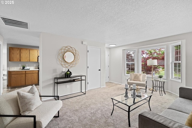 342 NW Denton Ave, Dallas, OR 97338 - living room with light carpet, a textured ceiling, and baseboards