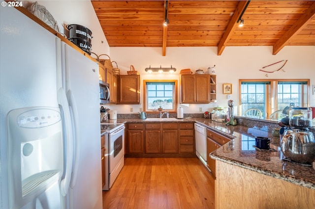 kitchen with lofted ceiling with beams, sink, wood ceiling, white appliances, and light hardwood / wood-style flooring