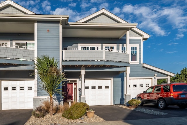 view of front of property with a balcony and a garage