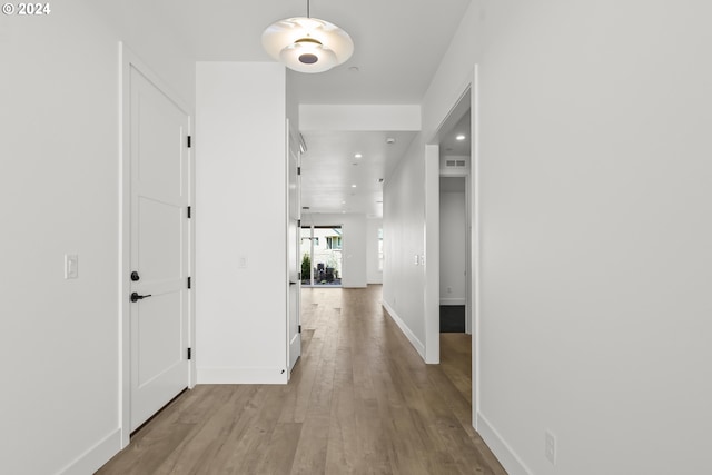 hallway featuring light wood-type flooring