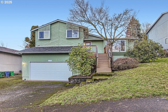 view of front of house featuring a deck and a garage