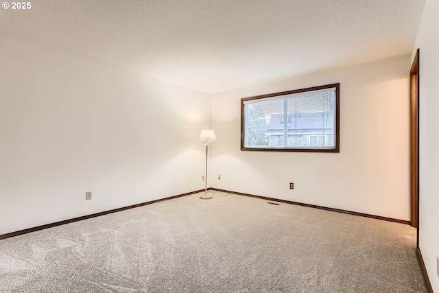 unfurnished room with carpet flooring