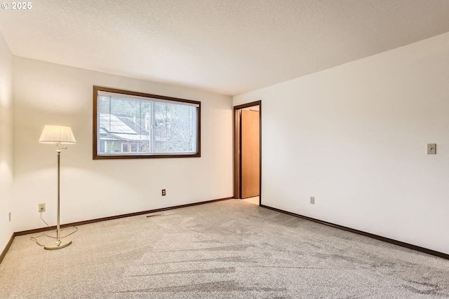 empty room featuring carpet floors