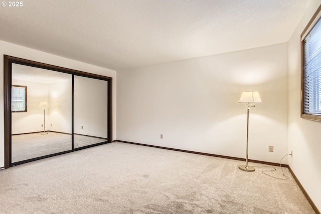 unfurnished bedroom featuring a closet and carpet