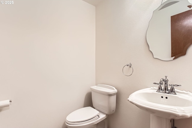 bathroom with toilet and sink