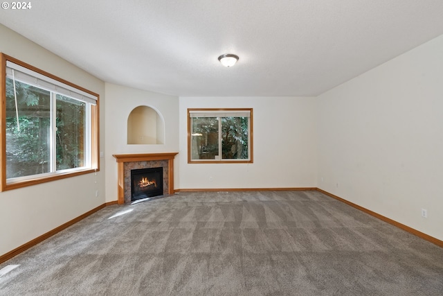 unfurnished living room with carpet flooring