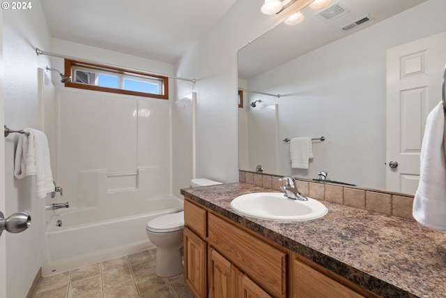 full bathroom with vanity, toilet, tile patterned flooring, and tub / shower combination