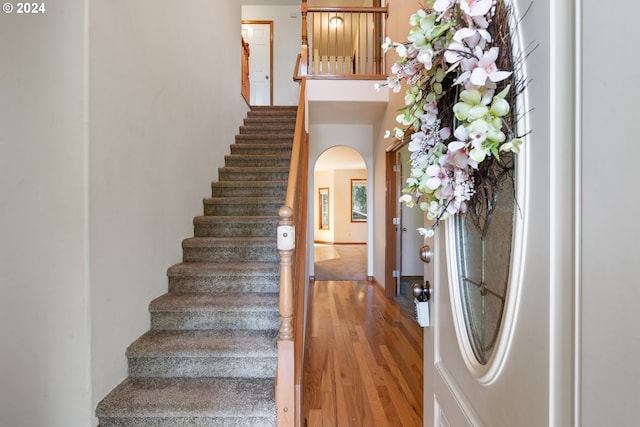 staircase featuring wood-type flooring