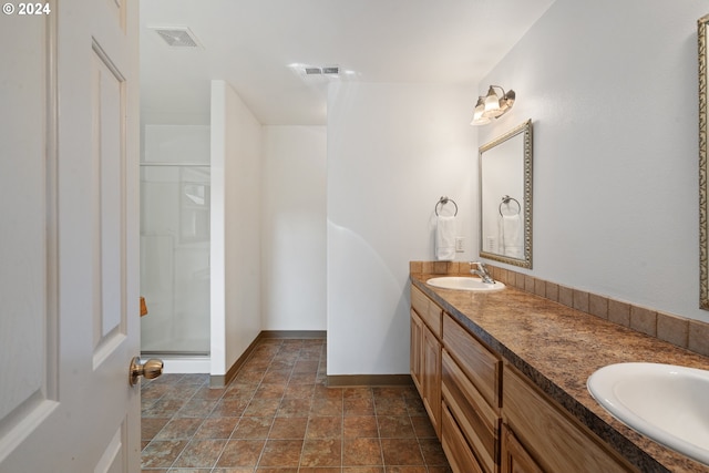 bathroom with vanity and walk in shower