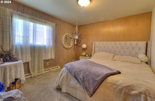 carpeted bedroom featuring a baseboard radiator and wood walls