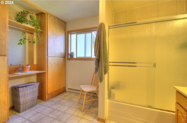 bathroom featuring enclosed tub / shower combo and vanity