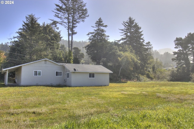 94200 Austin Ct, Gold Beach, OR 97444 - view of side of home with a wooded view and a yard